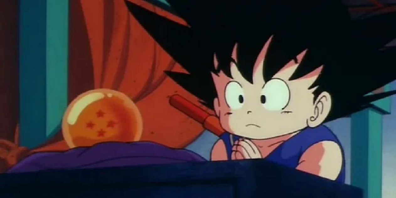 Goku traje azul y bola de dragón
